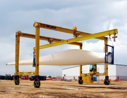 Wind Turbine Section Lifted By Two Travelifts With I Beams Featuring Center Swivels